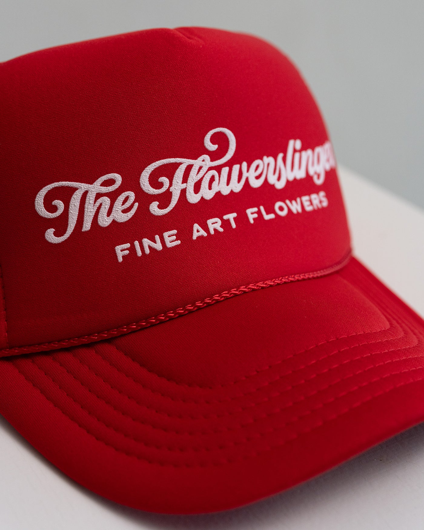 Red Flowerslinger Trucker Hat